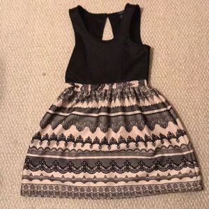 Black dress with tan, flare skirt design